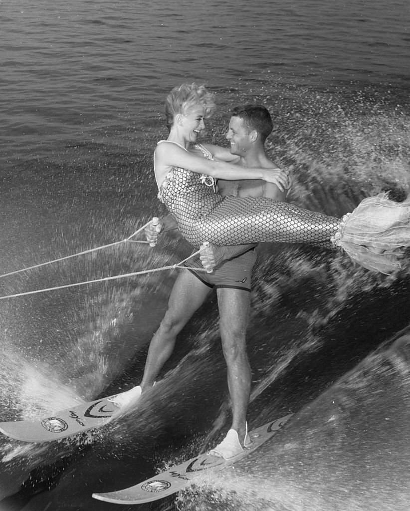 Water-ski champion Dick Pope and mermaid Jenny Phillips speed across the course at the US Ski Centre at Cypress Gardens, Florida, 1967