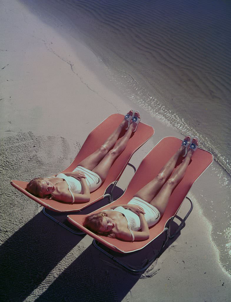 Cypress Gardens Aquamaids sun on the beach at Clearwater, Florida, 1956