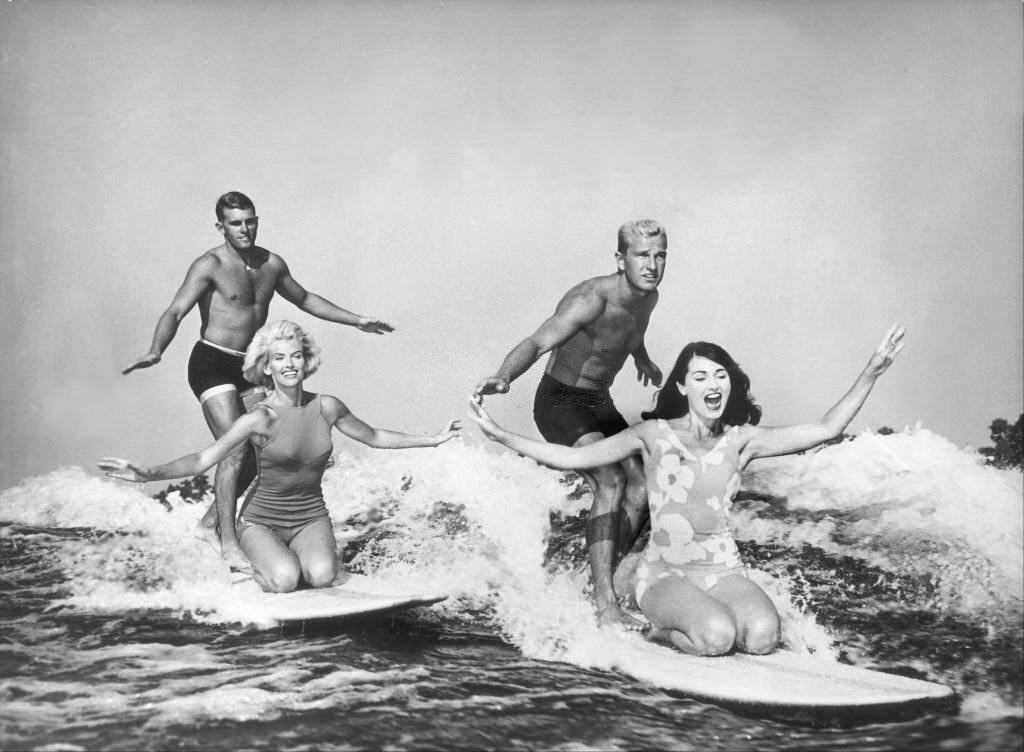 Water ski champions demonstrating their skills as they ride the wake of the waves without the use of a tow-line, at Cypress Gardens, 1965.