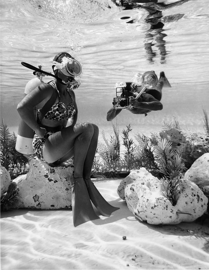 Girl and a Photographer scuba diving at Cypress Gardens, Florida, 1965