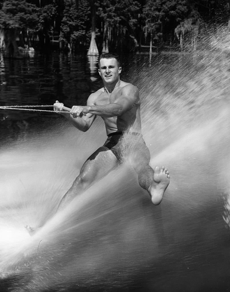 Mike Osborn demonstrates his technique of water-skiing on the ball of one foot at Cypress Gardens, Florida, 1965