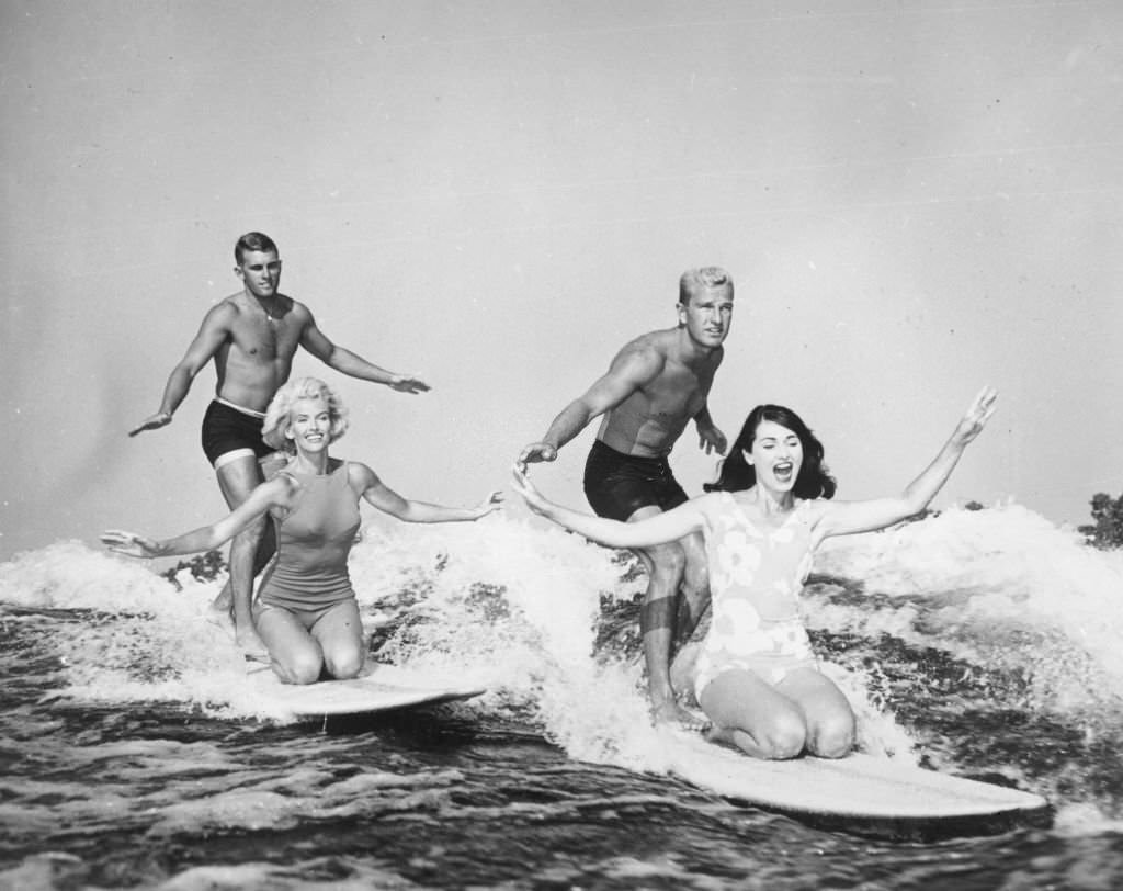 Two couples lake surfboarding in Cypress Gardens, Florida, 1965