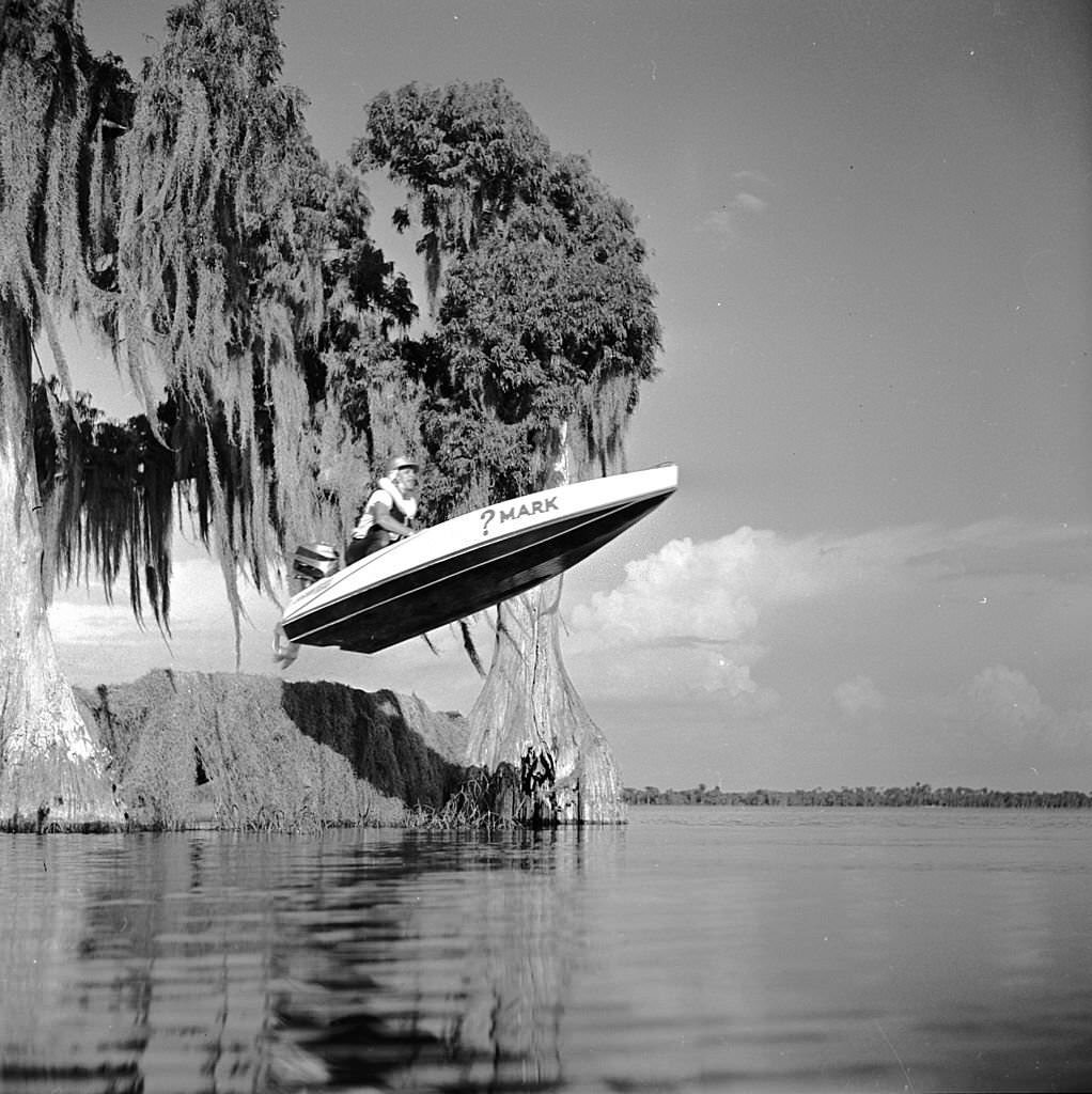 A boat flies over a ramp, just one of the obstacles on the Cypress Gardens speedboat race course in Florida, 1956