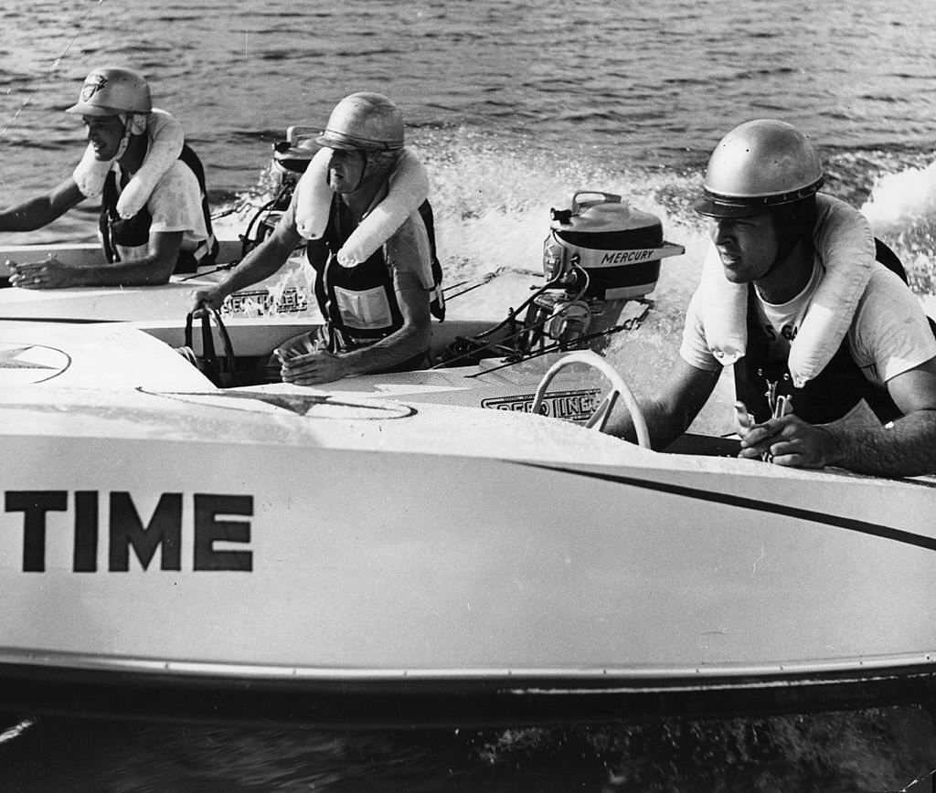 Participants in a power boat race at Cypress Gardens rev their motors at the starting line, 1955