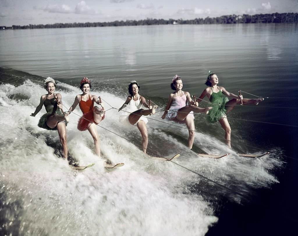 A group of acrobatic water skiers perform during a show at Cypress Gardens theme park in 1953 near Winterhaven, Florida.
