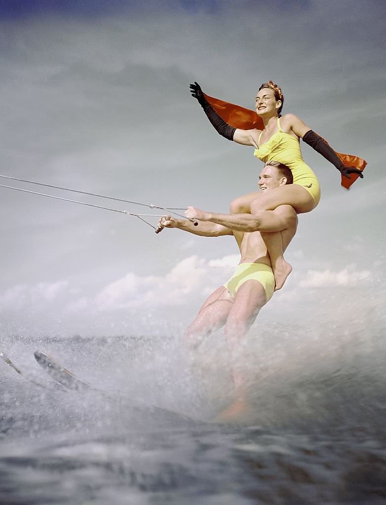 A pair of acrobatic water skiers perform during a show at Cypress Gardens theme park in 1953 near Winterhaven, Florida.