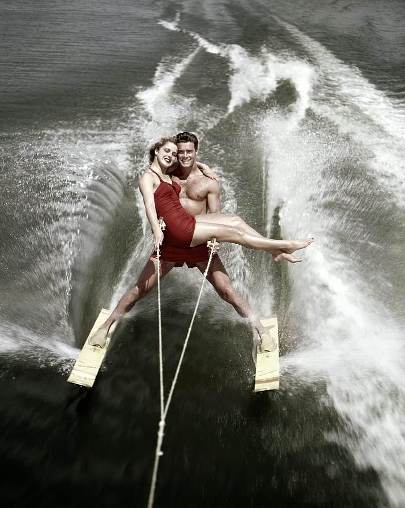 A pair of acrobatic water skiers perform during a show at Cypress Gardens theme park in 1953 near Winterhaven, Florida.