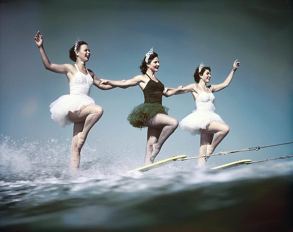 A trio of acrobatic water skiers perform during a show at Cypress Gardens theme park in 1953 near Winterhaven, Florida.