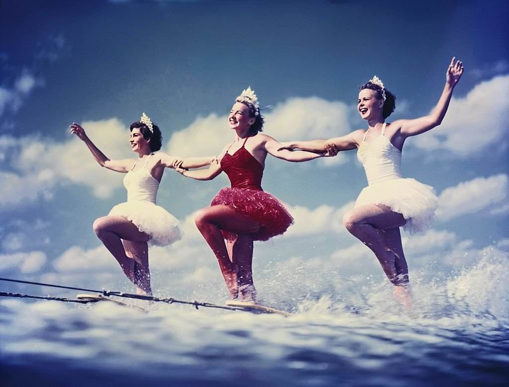 A trio of acrobatic water skiers perform during a show at Cypress Gardens theme park in 1953 near Winterhaven, Florida.