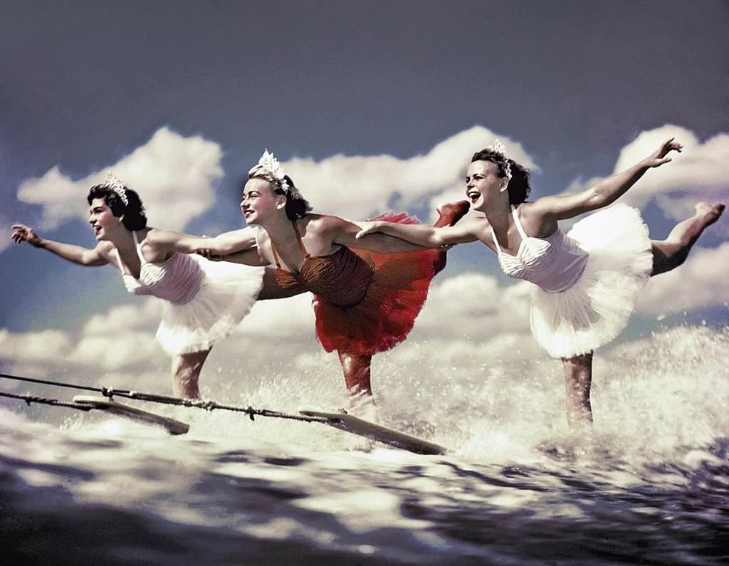 A trio of acrobatic water skiers perform during a show at Cypress Gardens theme park in 1953 near Winterhaven, Florida.