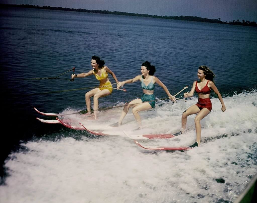 A trio of acrobatic water skiers perform during a show at Cypress Gardens theme park in 1953 near Winterhaven, Florida.