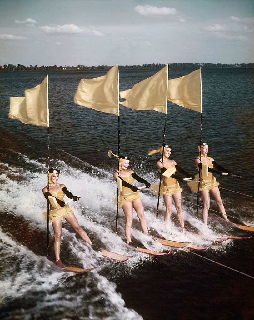 A group of acrobatic water skiers perform during a show at Cypress Gardens theme park in 1953 near Winterhaven, Florida.