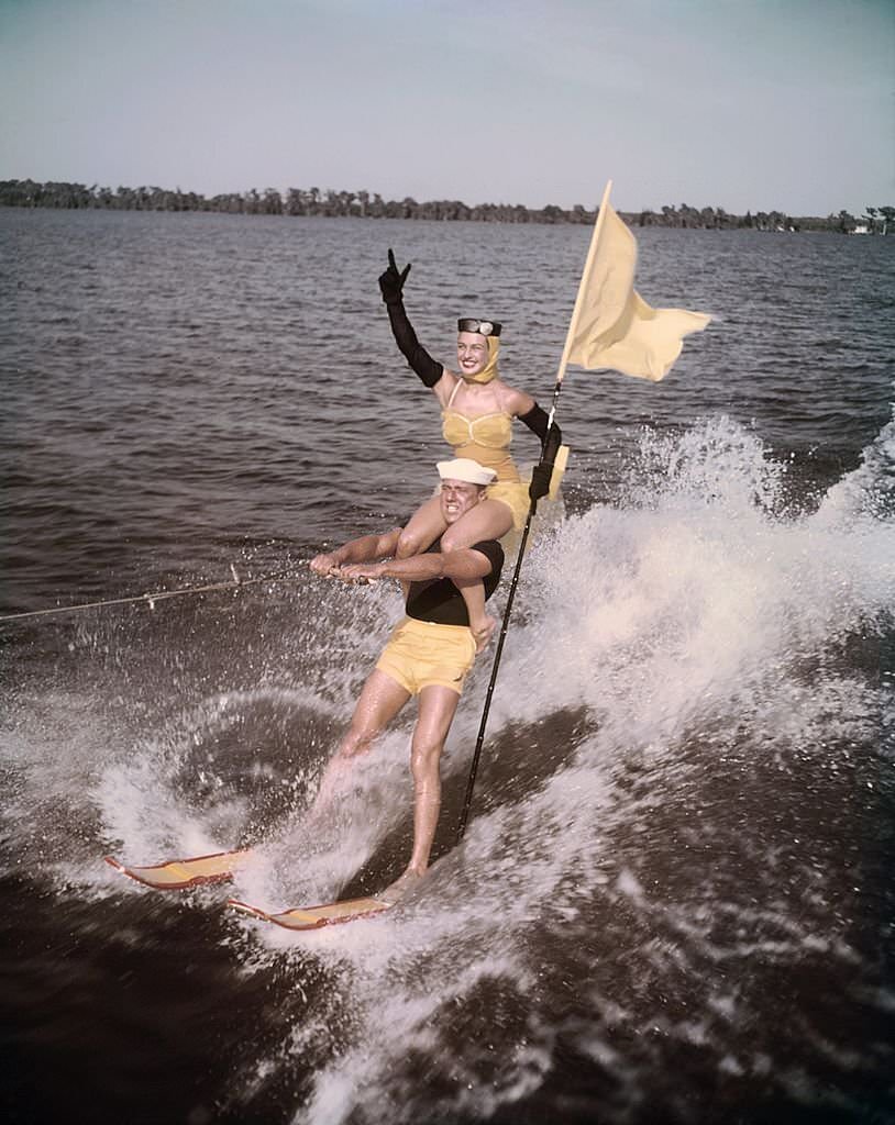 A pair of acrobatic water skiers perform during a show at Cypress Gardens theme park in 1953 near Winterhaven, Florida.