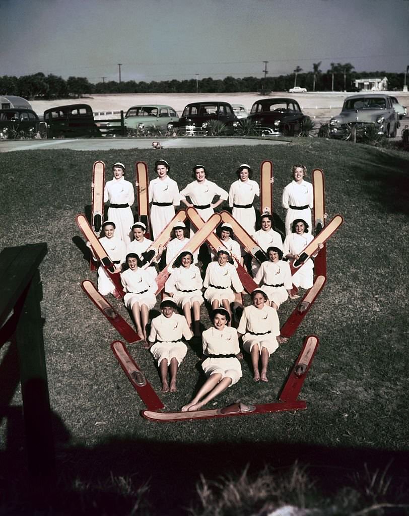 A group of acrobatic water skiers pose for a portrait at Cypress Gardens theme park in 1953 near Winterhaven, Florida.