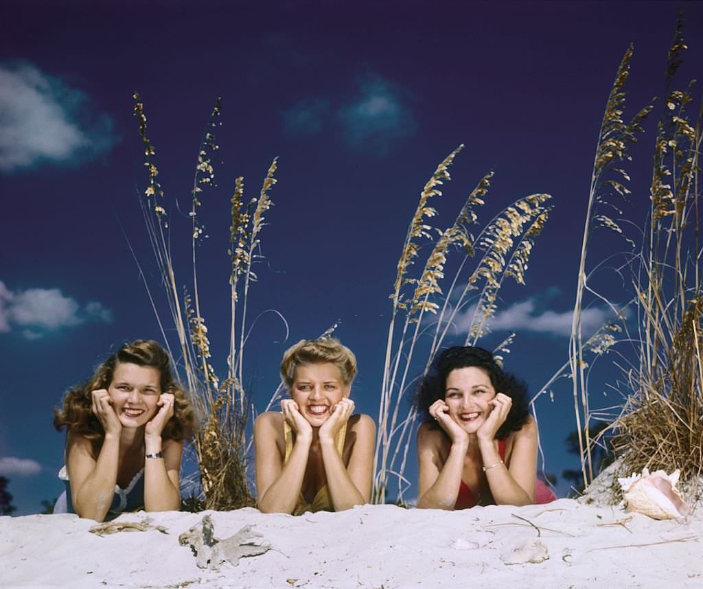 A group of southern belle models pose on the beach at Cypress Gardens theme park in 1953 near Winterhaven, Florida.