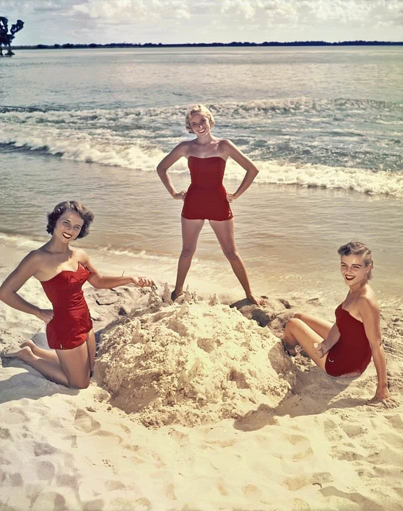 A group of southern belle models pose on the beach at Cypress Gardens theme park in 1953 near Winterhaven, Florida.