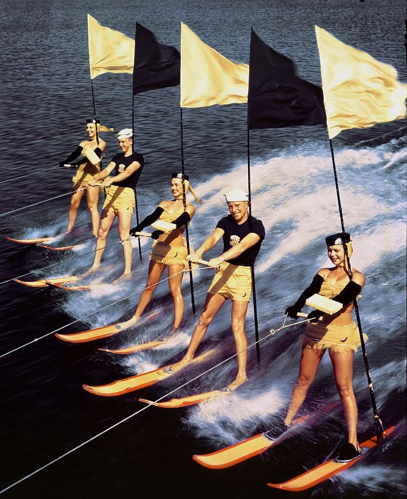 A group of acrobatic water skiers perform during a show at Cypress Gardens theme park in 1953 near Winterhaven, Florida.