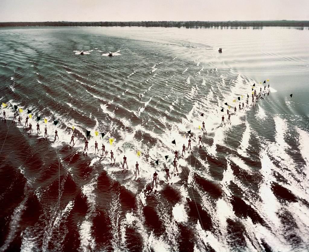 A group of acrobatic water skiers perform during a show at Cypress Gardens theme park in 1953 near Winterhaven, Florida.