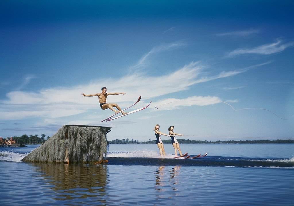 A trio of acrobatic water skiers perform during a show at Cypress Gardens theme park in 1953 near Winterhaven, Florida.