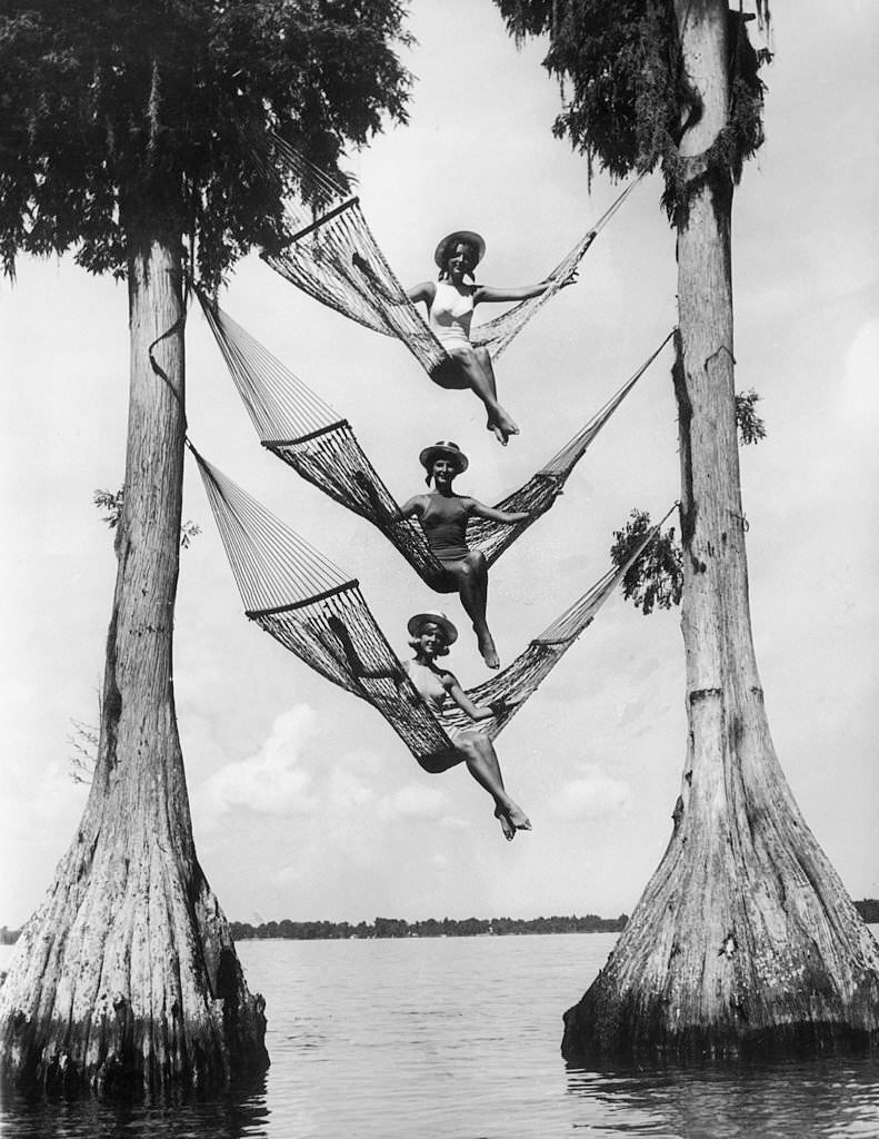 Three Young Women Struting About In Hammocks In Cypress Gardens, Florida, 1950s