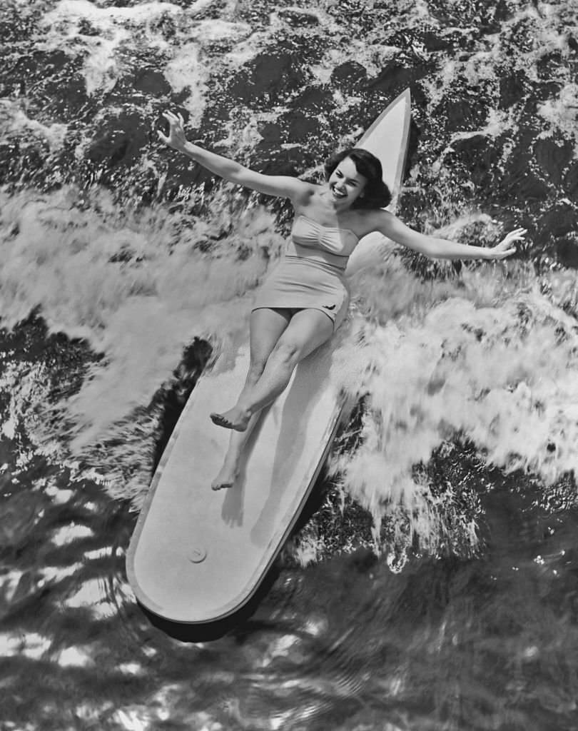 A woman demonstrates her skill on a toboggan on the waters at Cypress Gardens, Winter Haven in Florida in 1950.