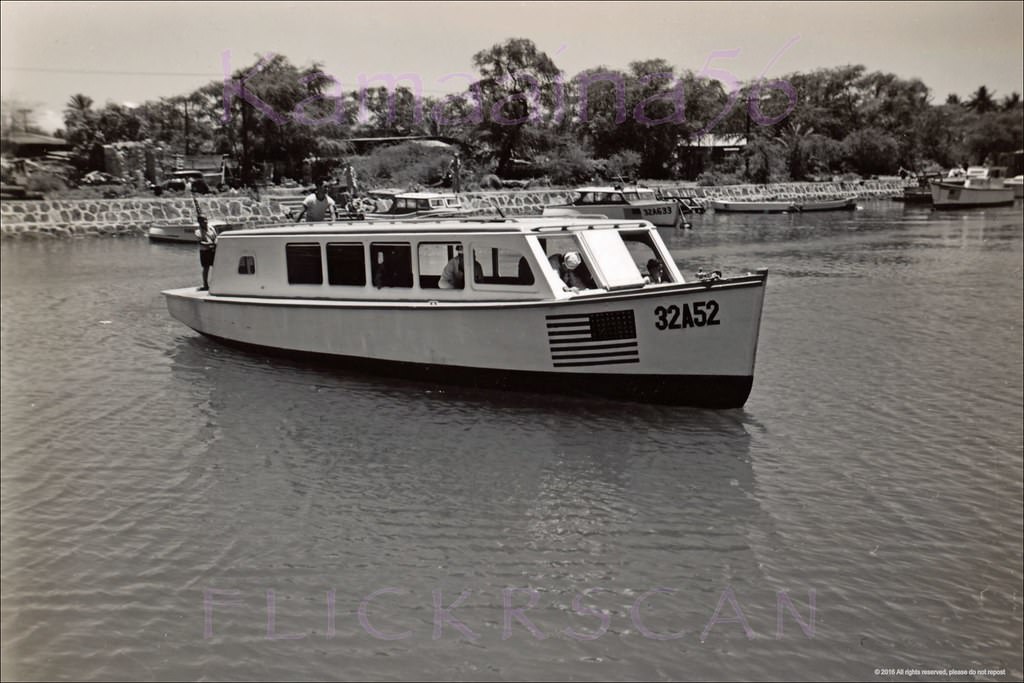 Glass bottom boat in Ala Wai Canal near the Kalakaua Avenue Bridge, 1940