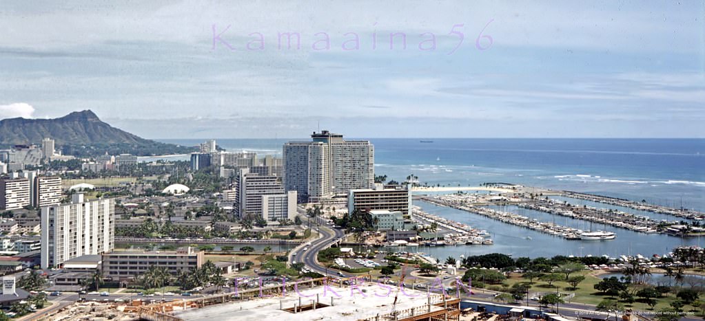 Detailed panoramic view of Honolulu and Waikiki looking Diamond Head from La Ronde revolving restaurant atop the 23-floor Ala Moana Building at Ala Moana Shopping Center, 1965