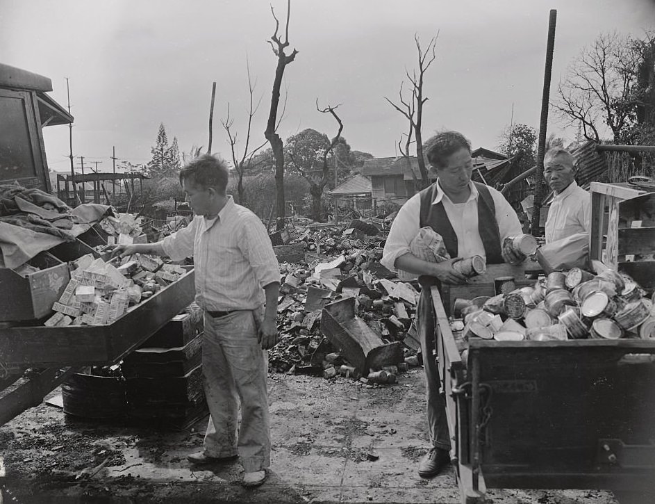 Japanese Merchants Going Through Debris of Bombed out Store, 1940s
