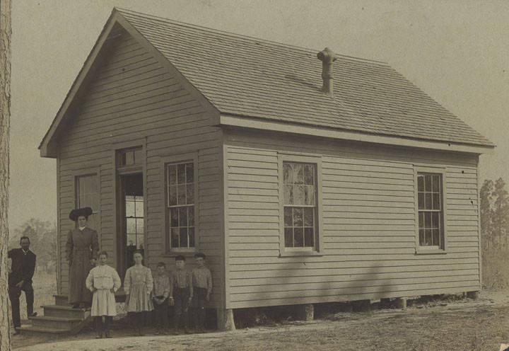 Students and teacher outside a school building in rural Mobile County, 1901
