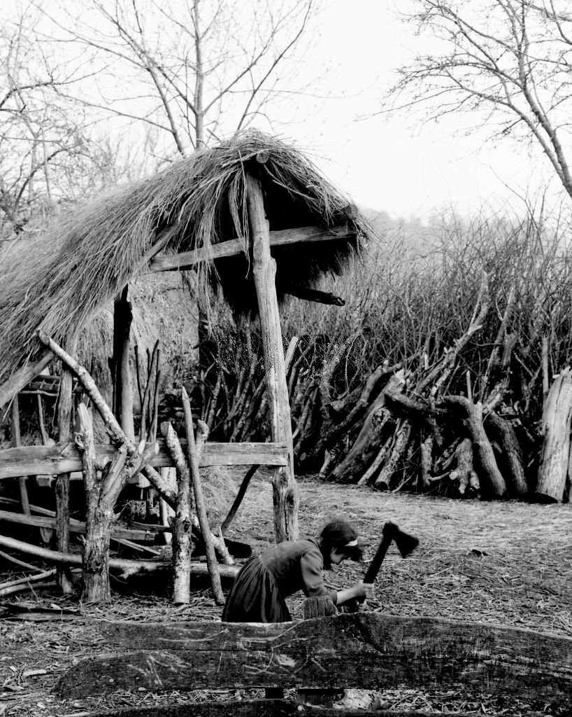 Girl cutting wood, Barella, Galicia, Spain, 1963.