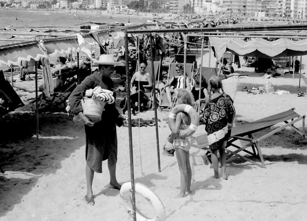 Grand Duke Otto von Habsburg with three of his daughters during a holiday, Benidorm, Alicante, Spain, 1963.