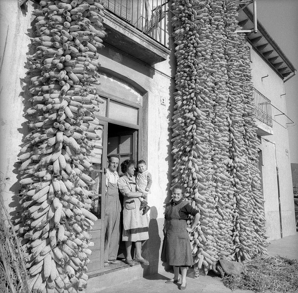 Family with corn crop at house door, Barcelona, 1961.