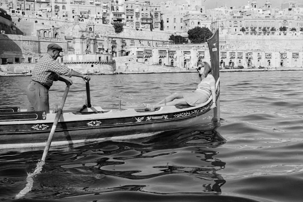 A tourist relaxing during a rowing boat trip. Canary Islands, 1968