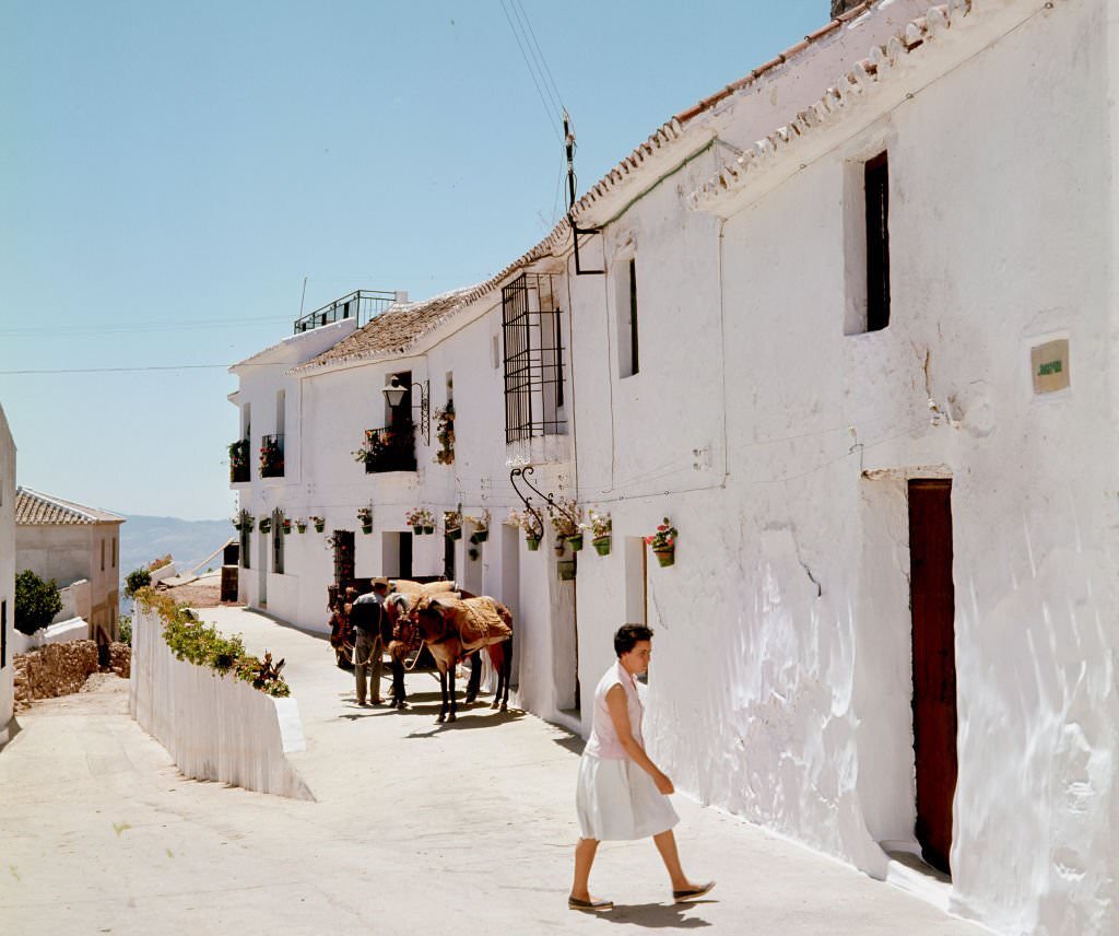 View along an unidentified street, Marbella, Malaga, Andalusia, Spain, 1964.