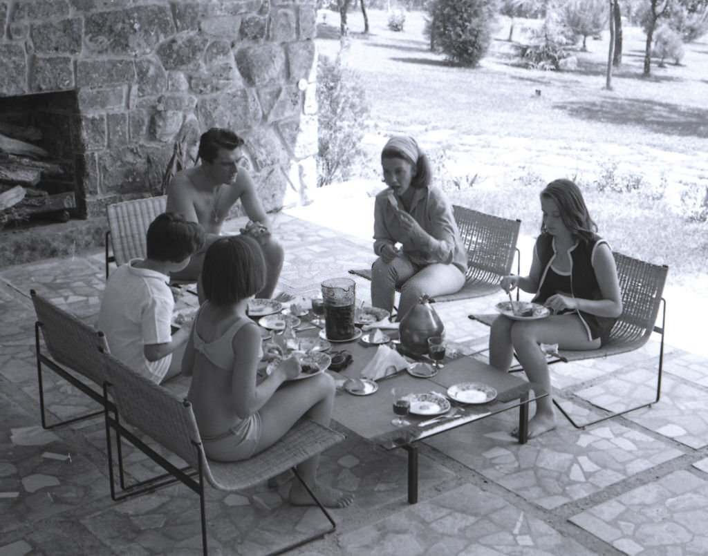 Linda Christian at home of La Moraleja with her husband Edmund Purdom and daughters Romina and Taryn, Madrid, Spain, 1964.
