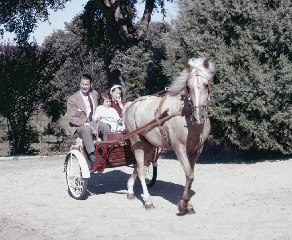 Spanish aristocrat Cristobal Martinez Bordiu, Marquis of Villaverde, in a carriage ride with his children in the garden of Pardo Palace, Madrid, Spain, 1962.