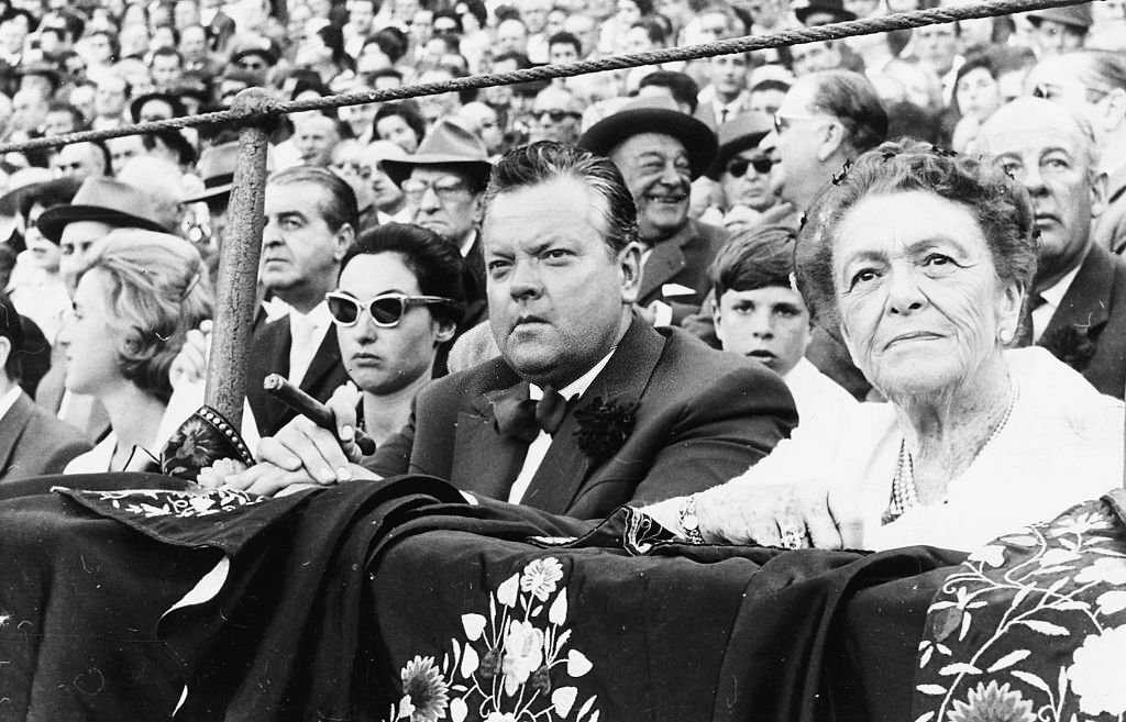 Actor and director Orson Welles sitting on the front row watching the traditional Spring Festival in Seville, April 24th 1961.