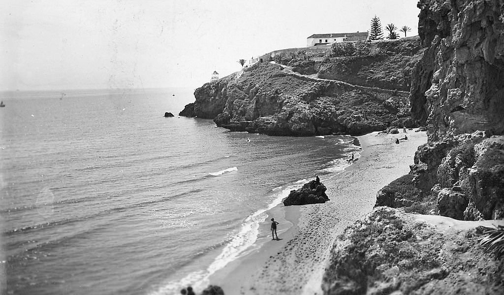 An elevated view from the cliffs over the beach and headland of the southern coast, Malaga, Spain, 1960.