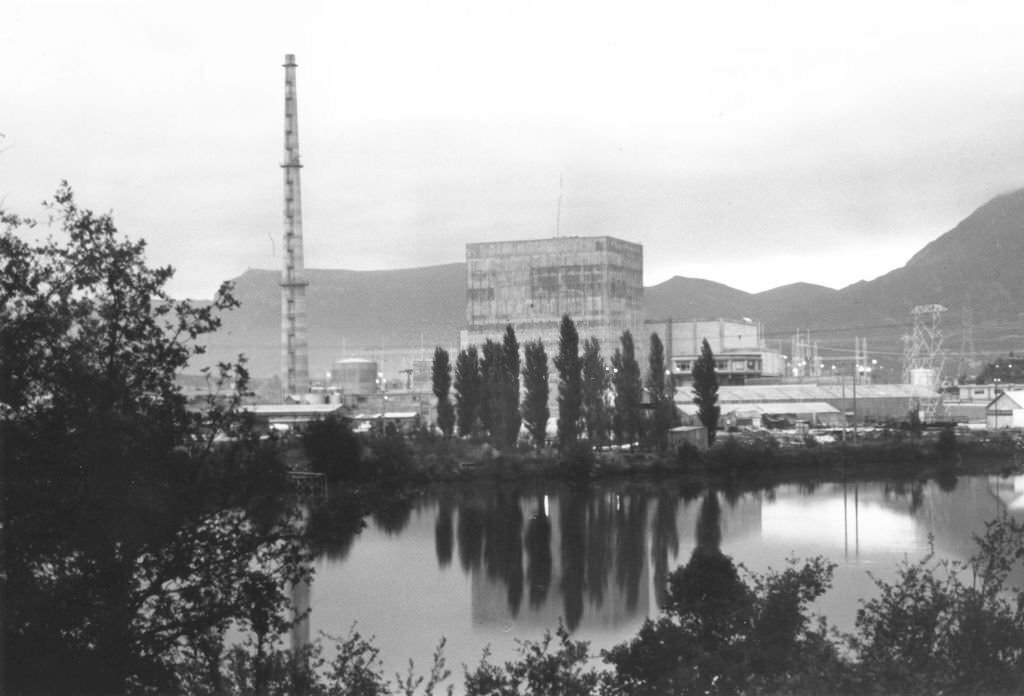 Obscured view of Santa Maria de Garona Nuclear Power Plant, with the Ebro river in the foreground, Burgos, Spain, 1971.