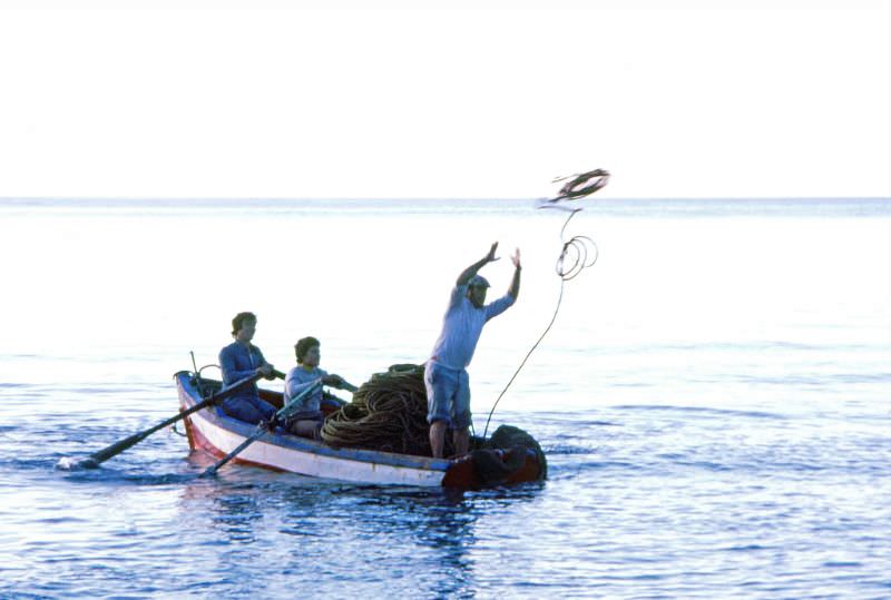 Fisherman casts his line off the beach, Almuñécar, 1977