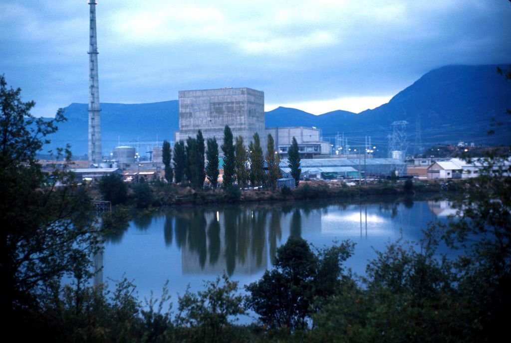 Obscured view of the Santa Maria de Garona Nuclear Power Plant, with the Ebro river in the foreground, Burgos, Spain, 1970.