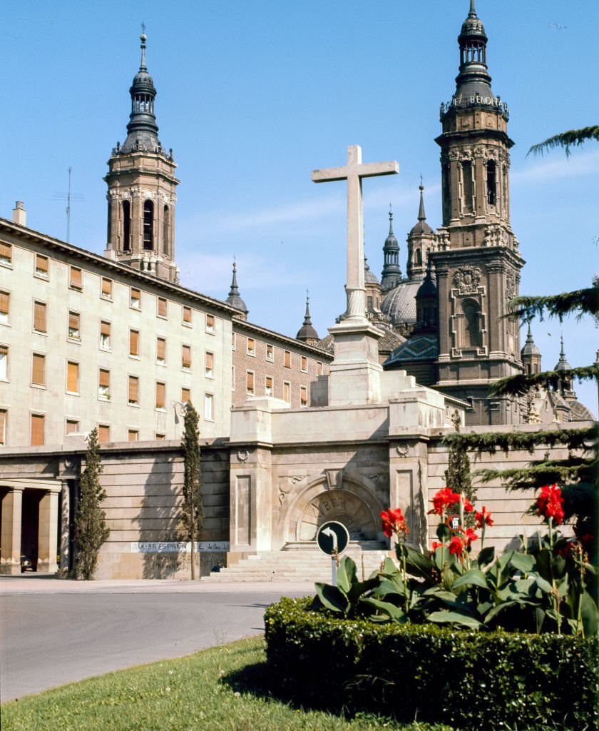 View of a large stone cross in the Plaza del Pilar, Zaragoza, Aragon, Spain, 1985.