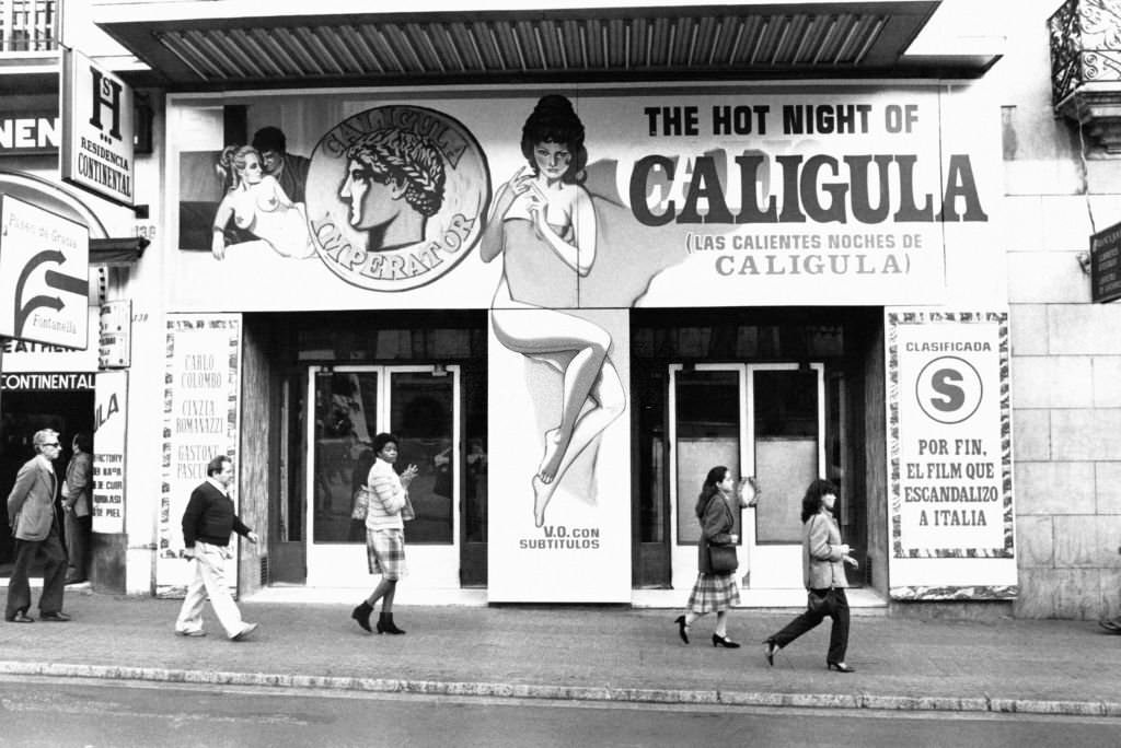 Poster of the erotic film 'The Crazy Nights of Caligula' in front of a cinema on La Rambla, in Barcelona, Spain, on November 25, 1982.