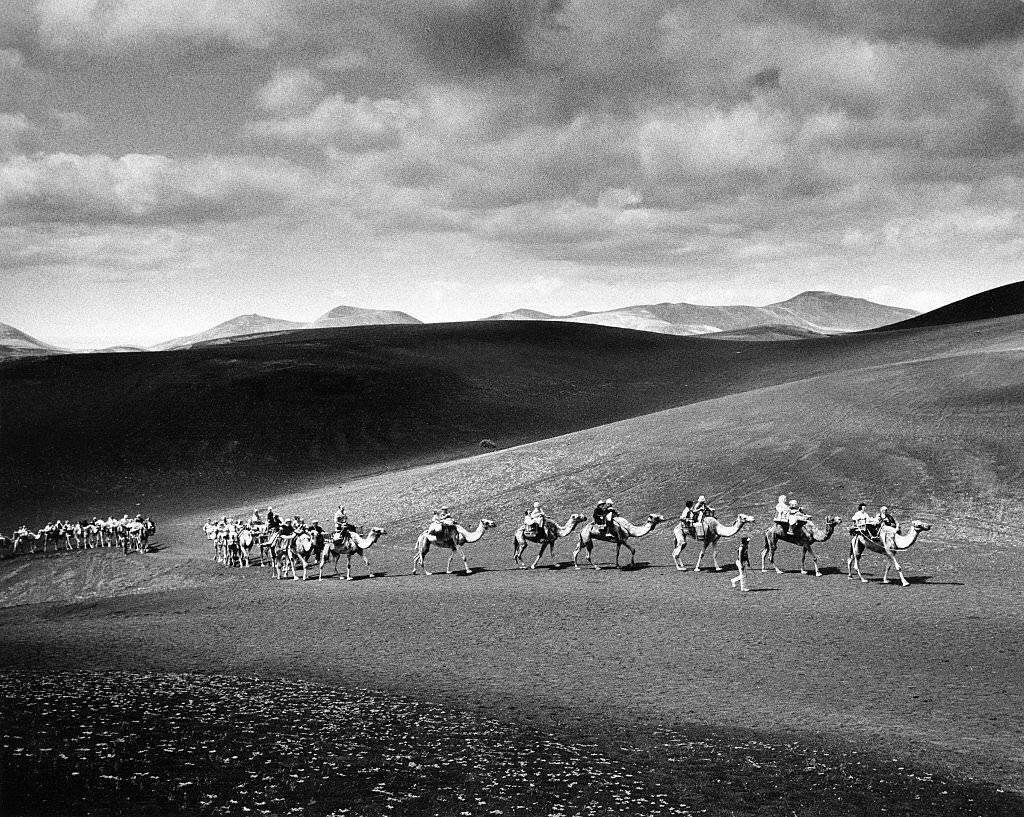 Caravan with tourists on their way to the fire mountains at Timanfaya National Park, 1982