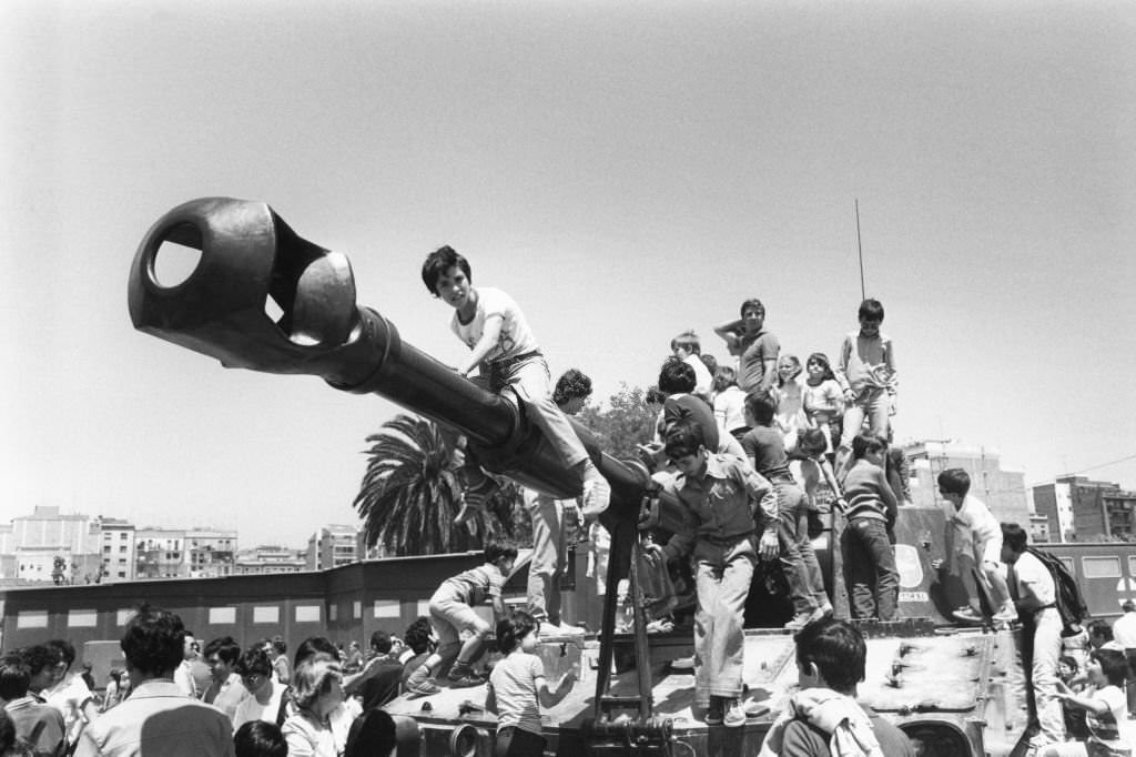 Crowd on a tank during the Army Day parade in Barcelona, May 30, 1981.
