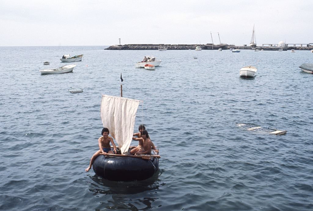 Young people with a sailing boat, Lanzarote, 1980