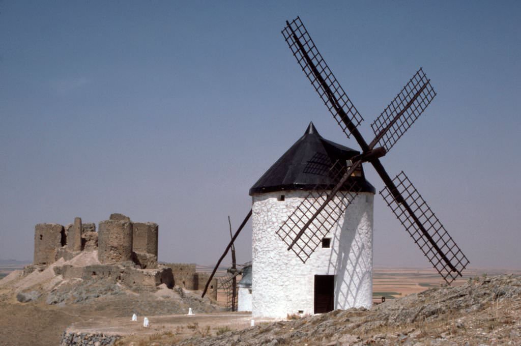 Mill in front of the Muela castle in Consuegra, in October 1985, in Castile-La Mancha, Spain.