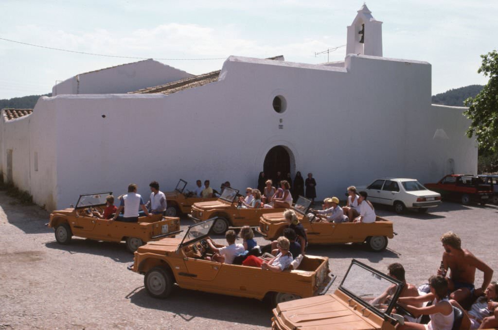 Tourists in 'Citroën Méhari' cars in Ibiza, July 1985, Balearic Islands, Spain.