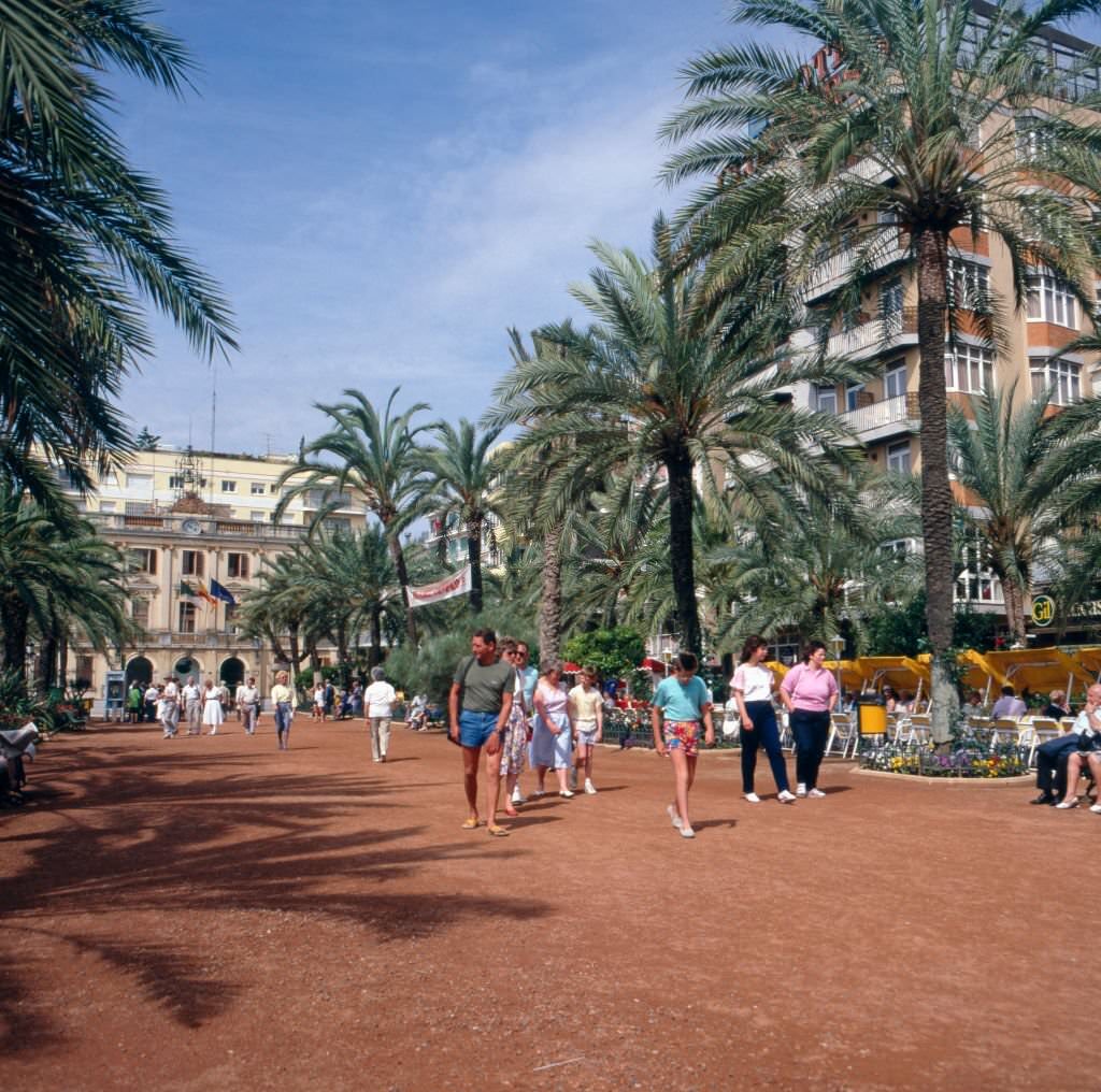 Tourists on their way in Lloret de Mar, Spain 1980s.