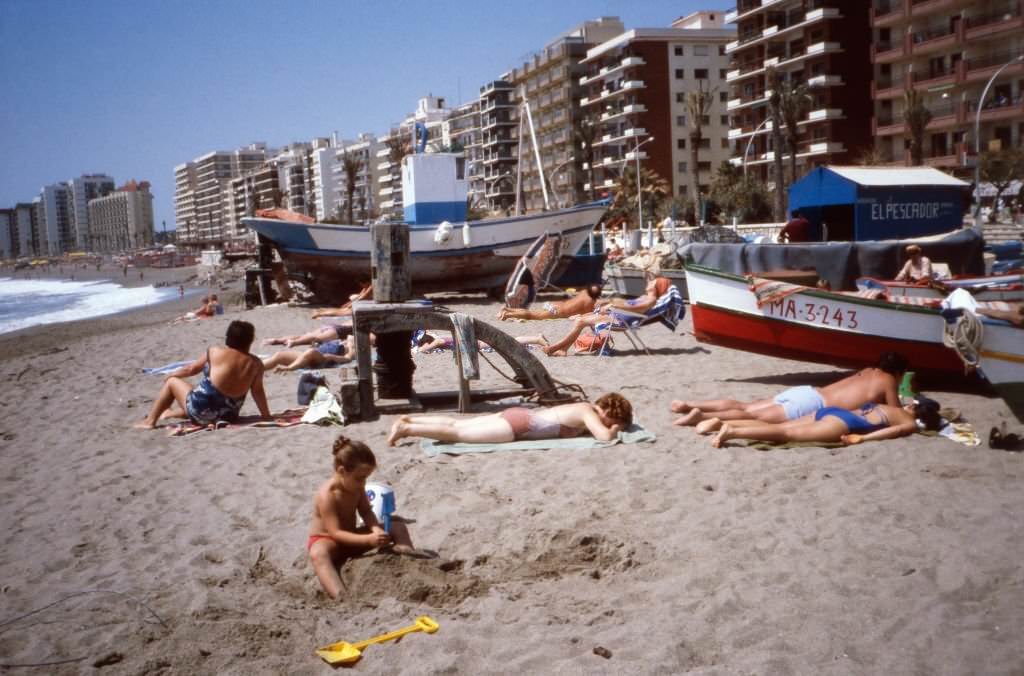 A day at the beach of Fuengirola at the Costa del Sol, Andalusia, Spain 1980s.